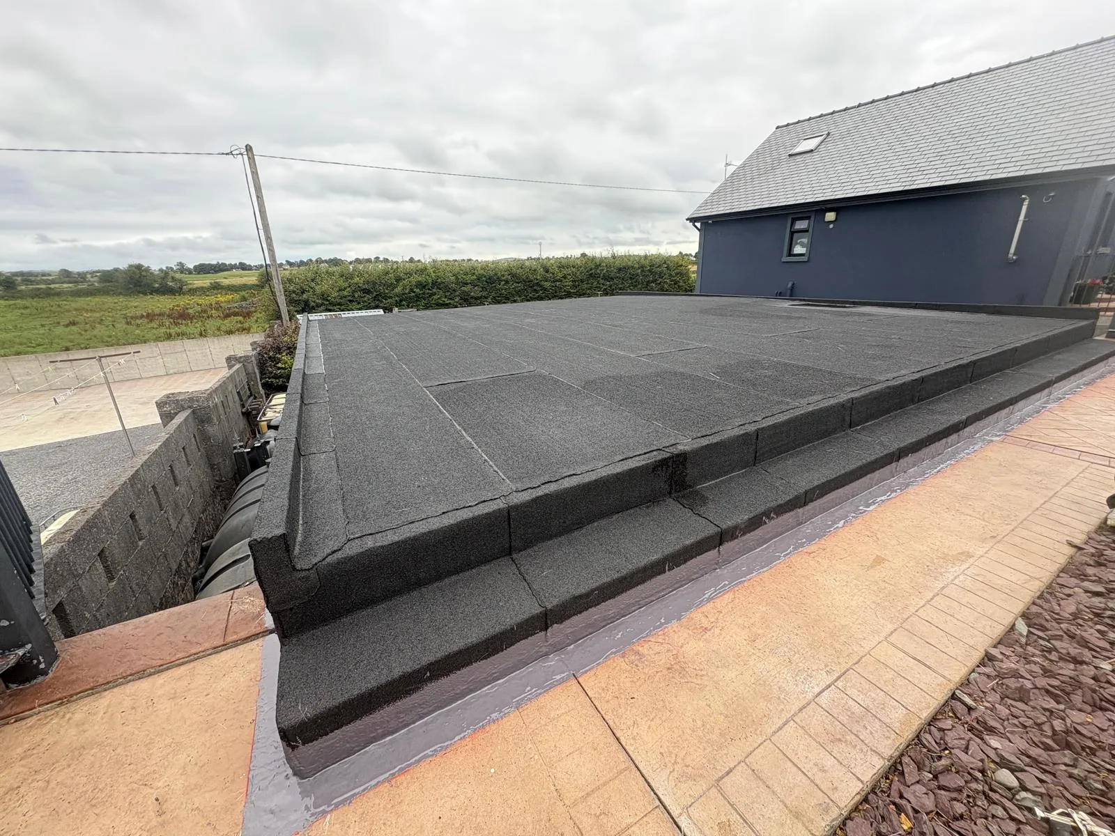 Flat roof edge and flashing detailing in Mayo
